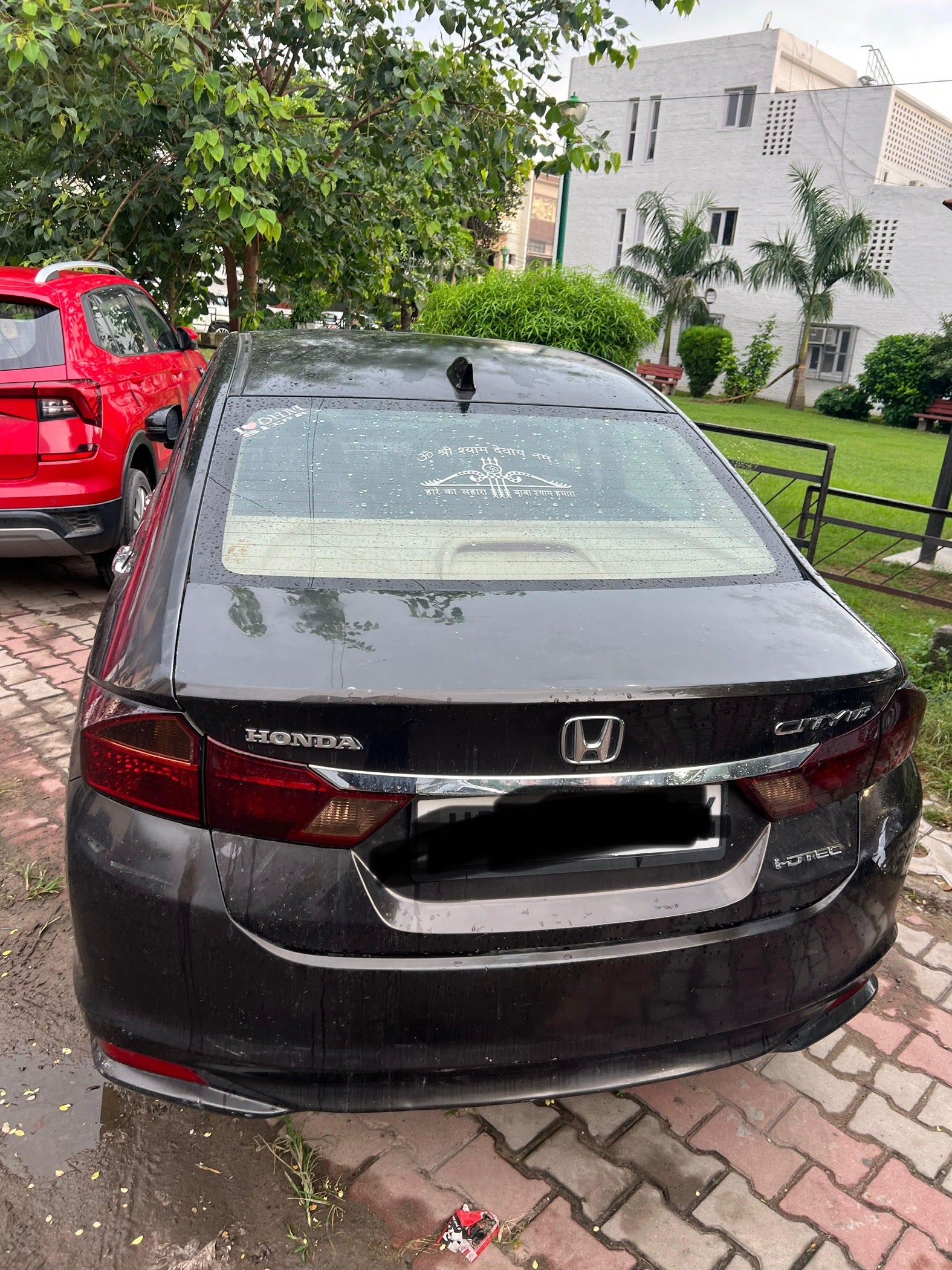 Rear view of a Honda City parked outdoors