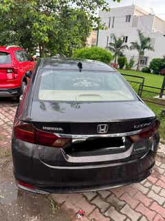 Rear view of a Honda City parked outdoors