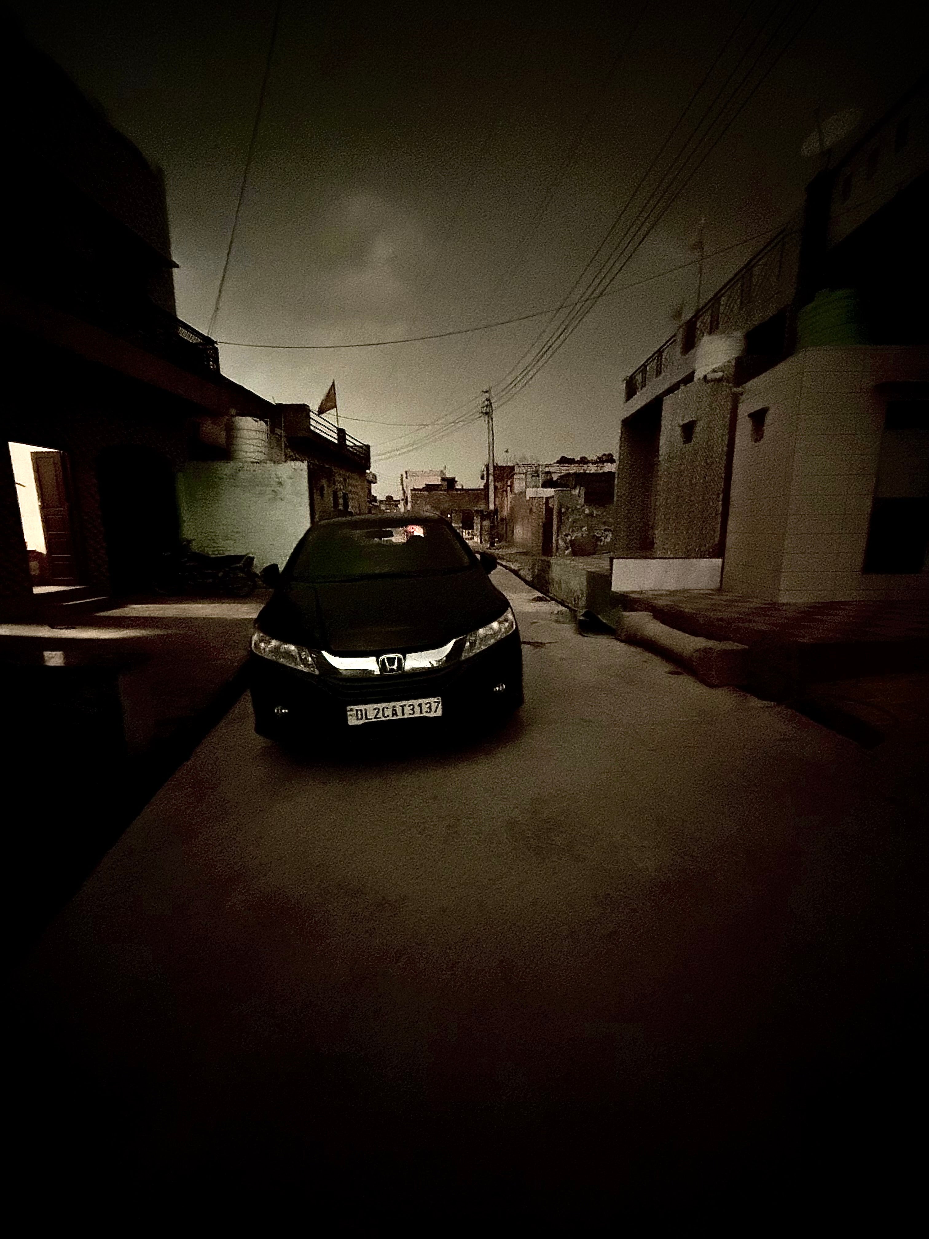 front view of a Honda City on a residential street