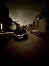 front view of a Honda City on a residential street