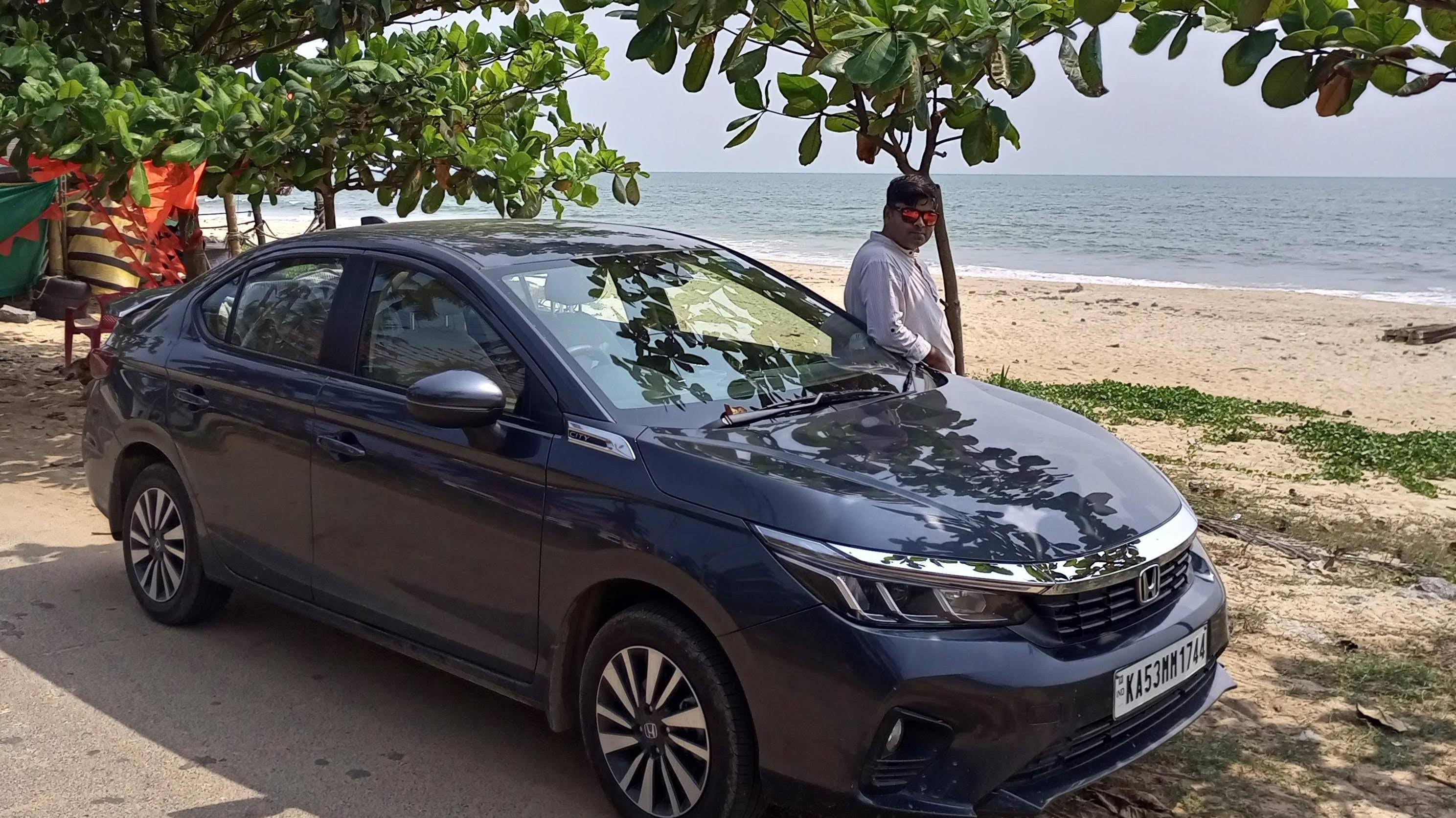 front three-quarter view of a Honda City by the beach