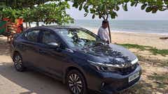 front three-quarter view of a Honda City by the beach