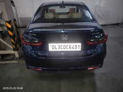 rear view of a Honda City in a garage