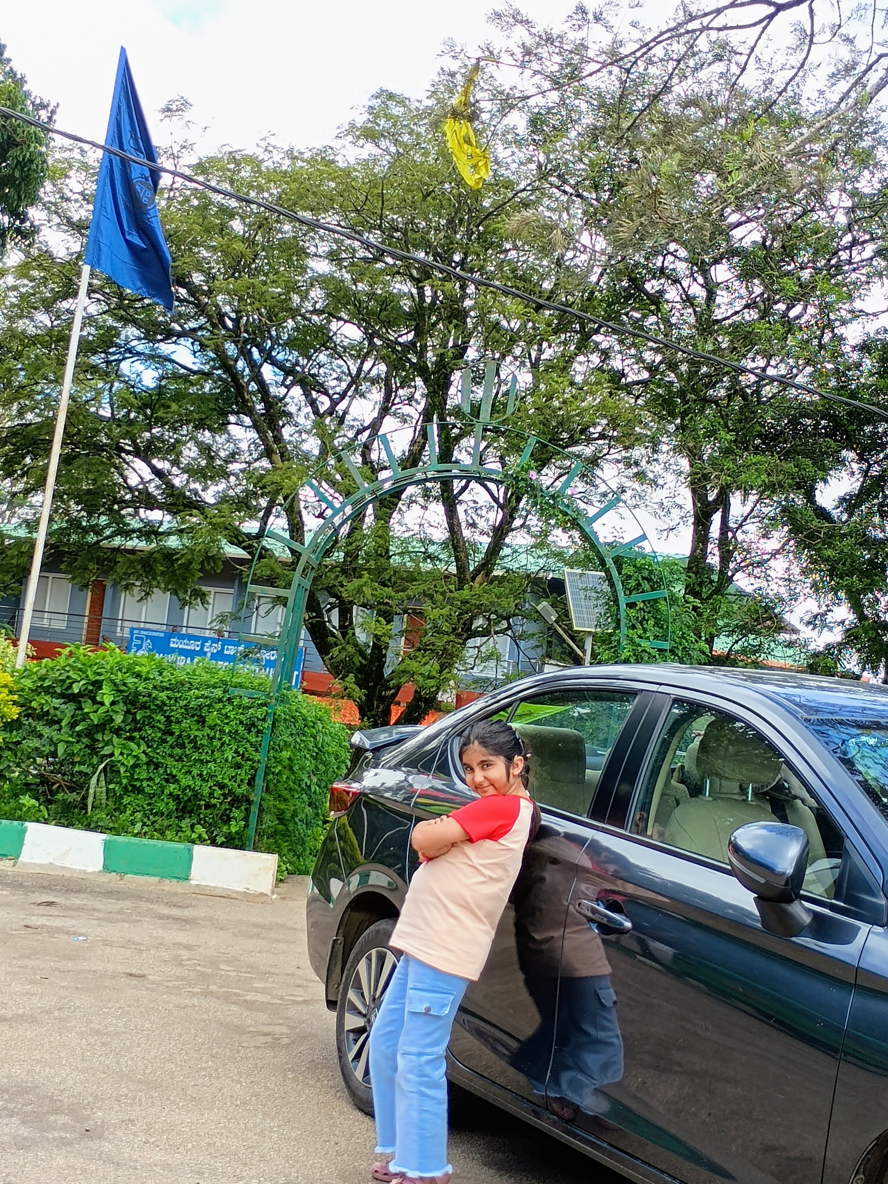 side view of a Honda City sedan with a person standing beside it