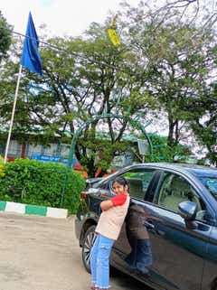 side view of a Honda City sedan with a person standing beside it