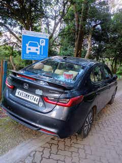 rear three-quarter of a Honda City in parking area