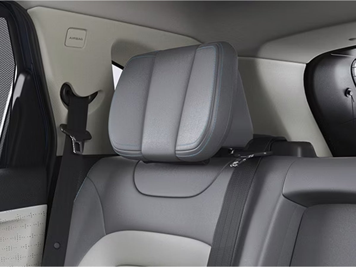 Rear seat headrest and seatbelt view of a Tata Harrier EV