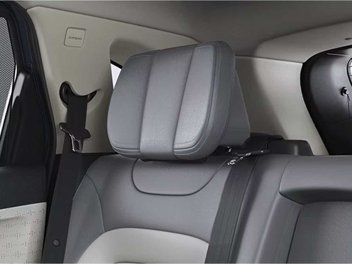 Rear seat headrest and seatbelt view of a Tata Harrier EV