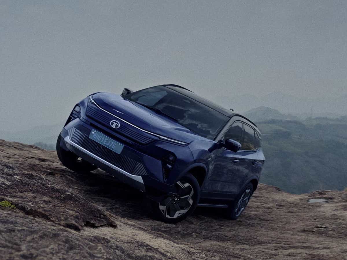 front three-quarter view of a Tata Harrier EV on a rocky terrain