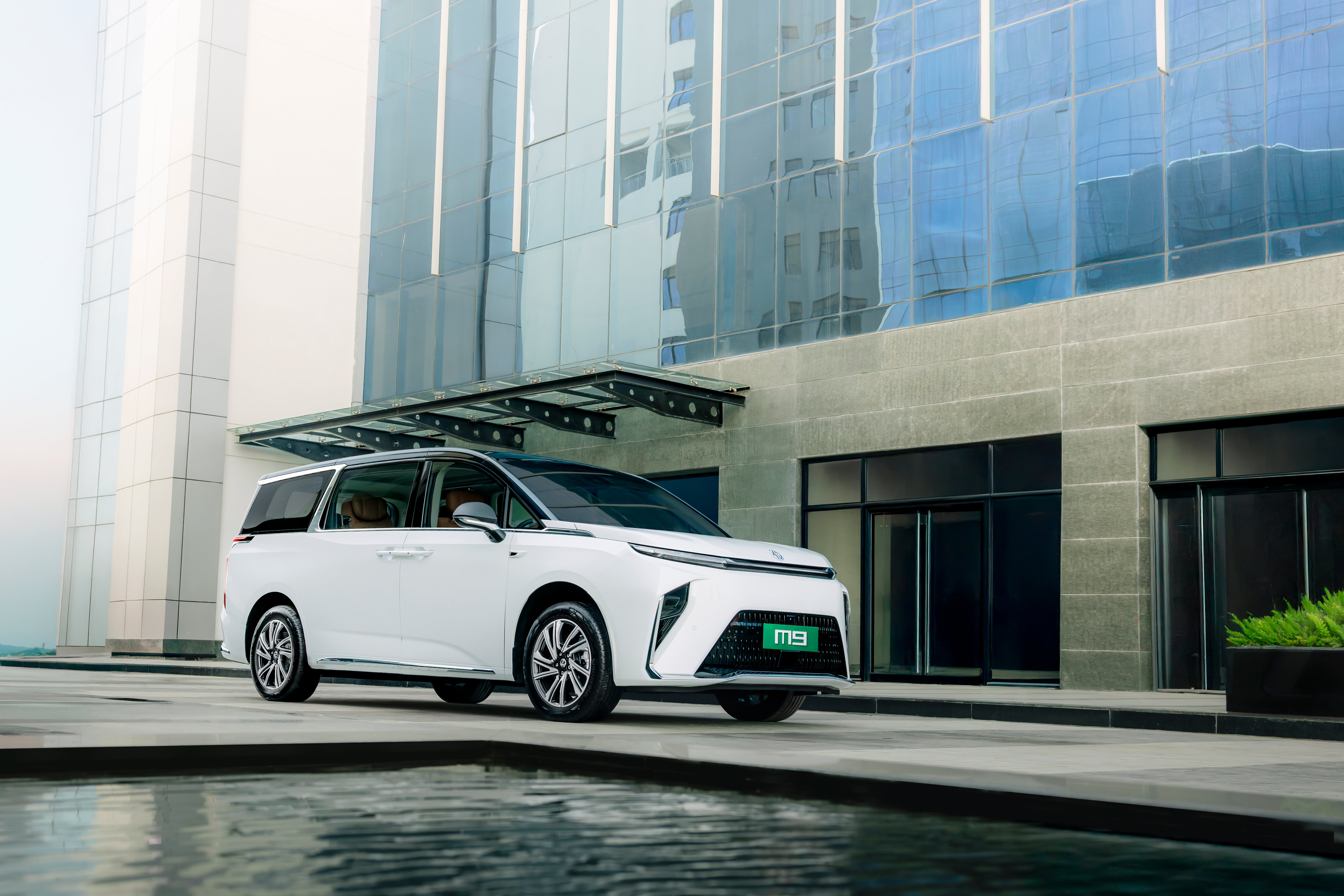 front three-quarter view of a Pearl White with Black Roof MG M9