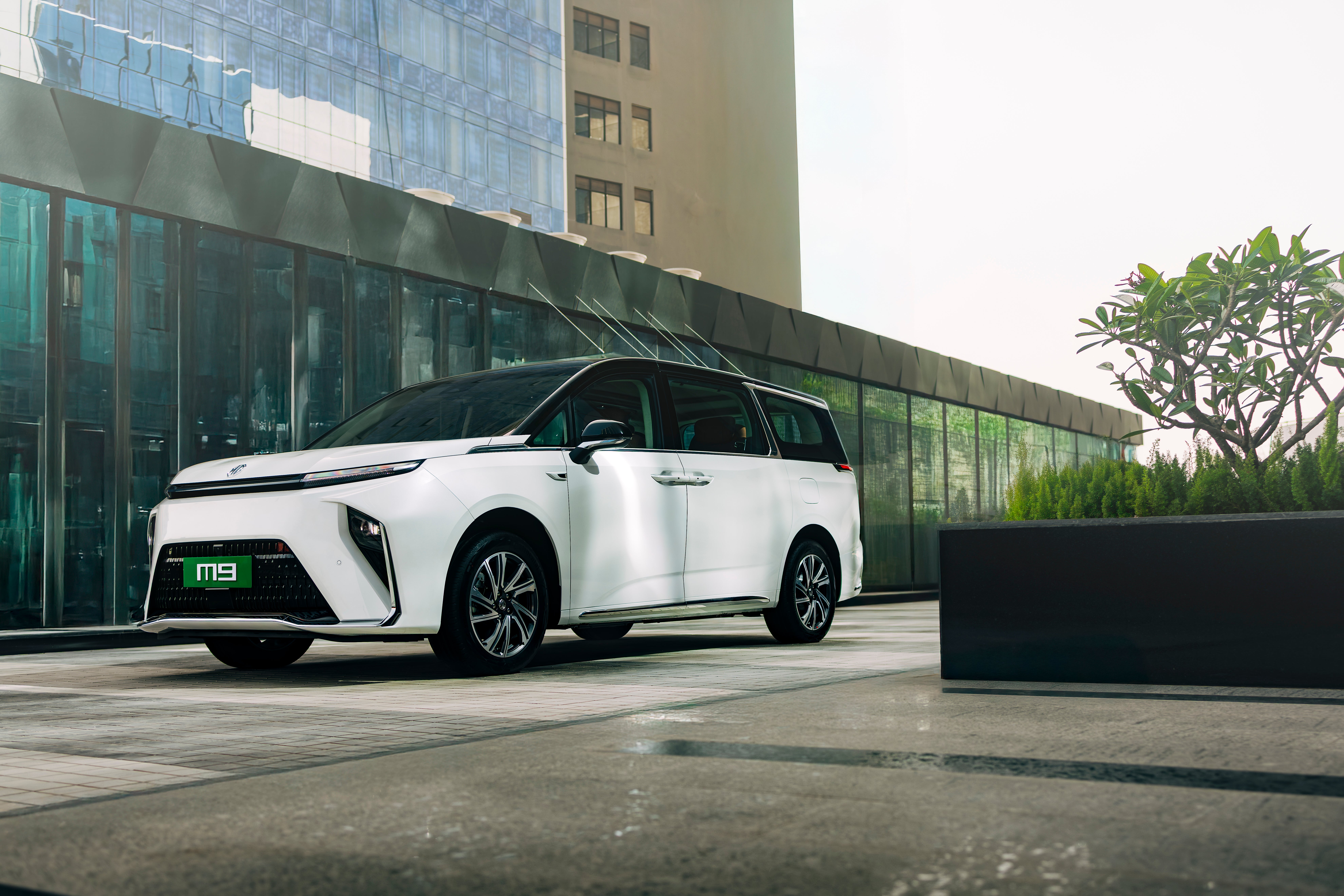 front three-quarter view of a Pearl White with Black Roof MG M9