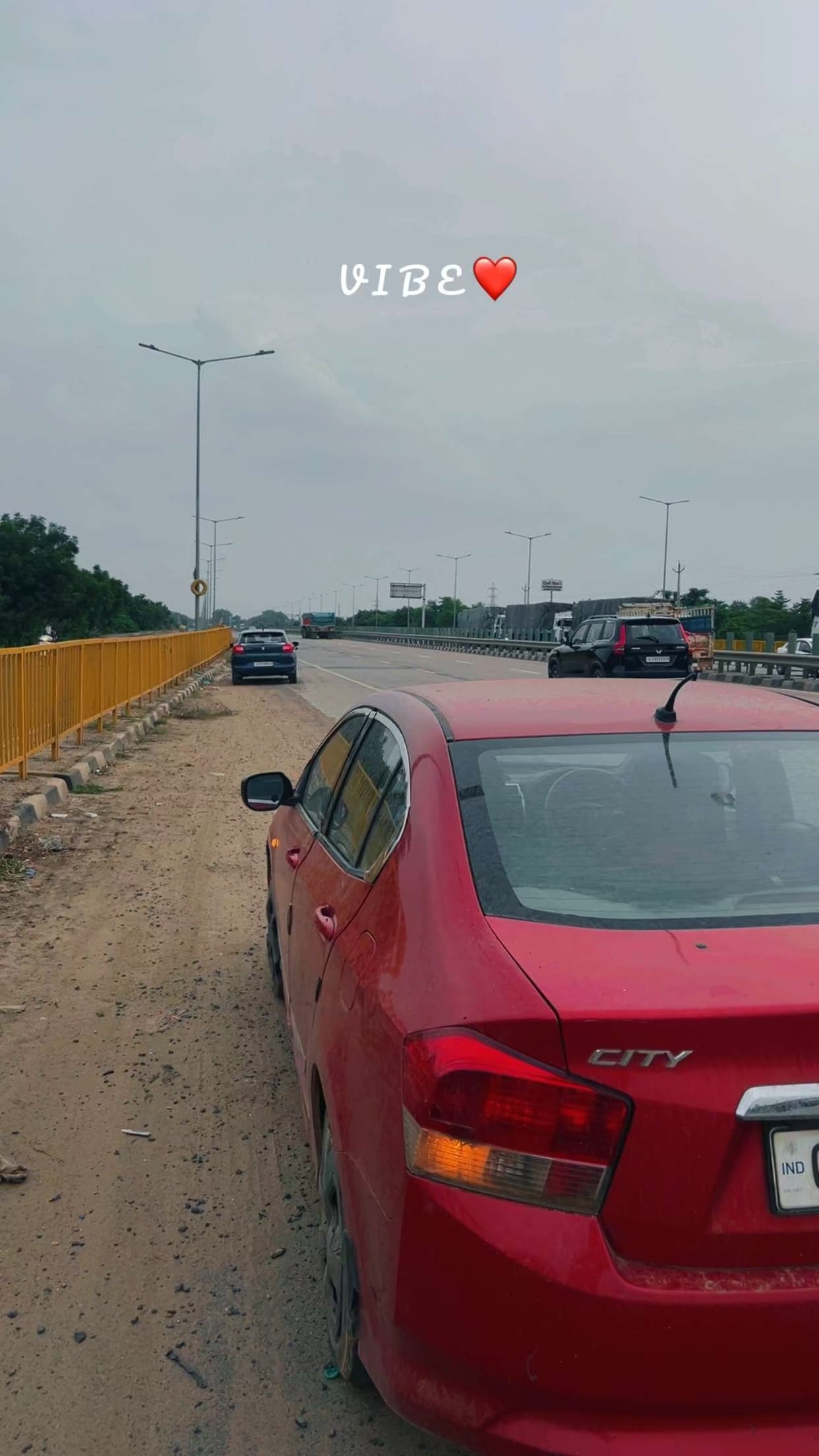 Rear view of a Honda City on a roadside