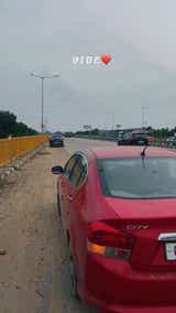 Rear view of a Honda City on a roadside