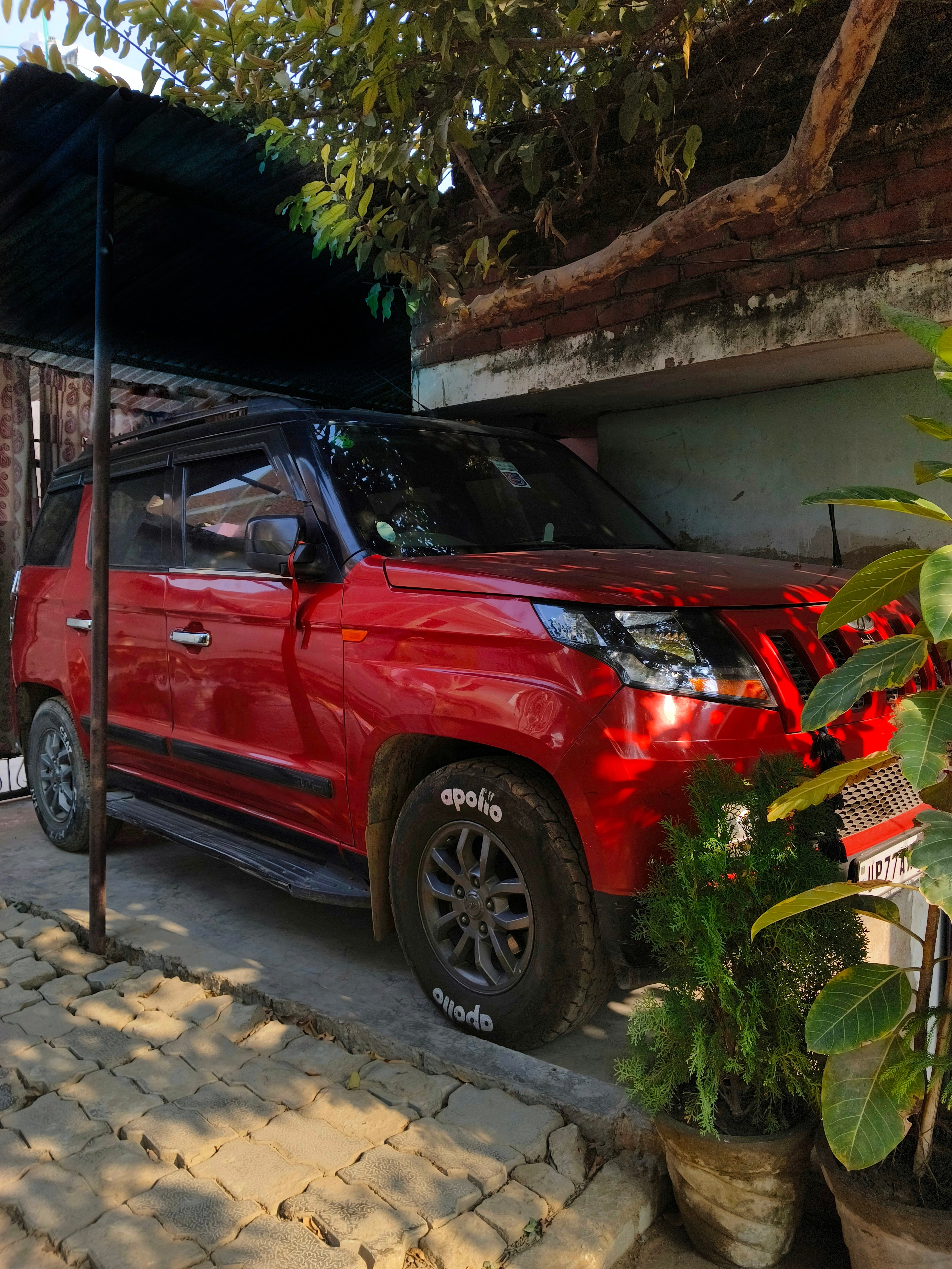 Front and side view of a Mahindra Bolero Neo
