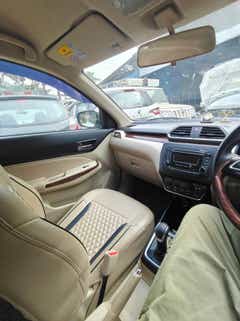 interior dashboard view of a Maruti Suzuki Dzire 2018-2023