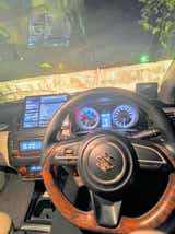 interior dashboard view of a Maruti Suzuki Dzire 2018-2023