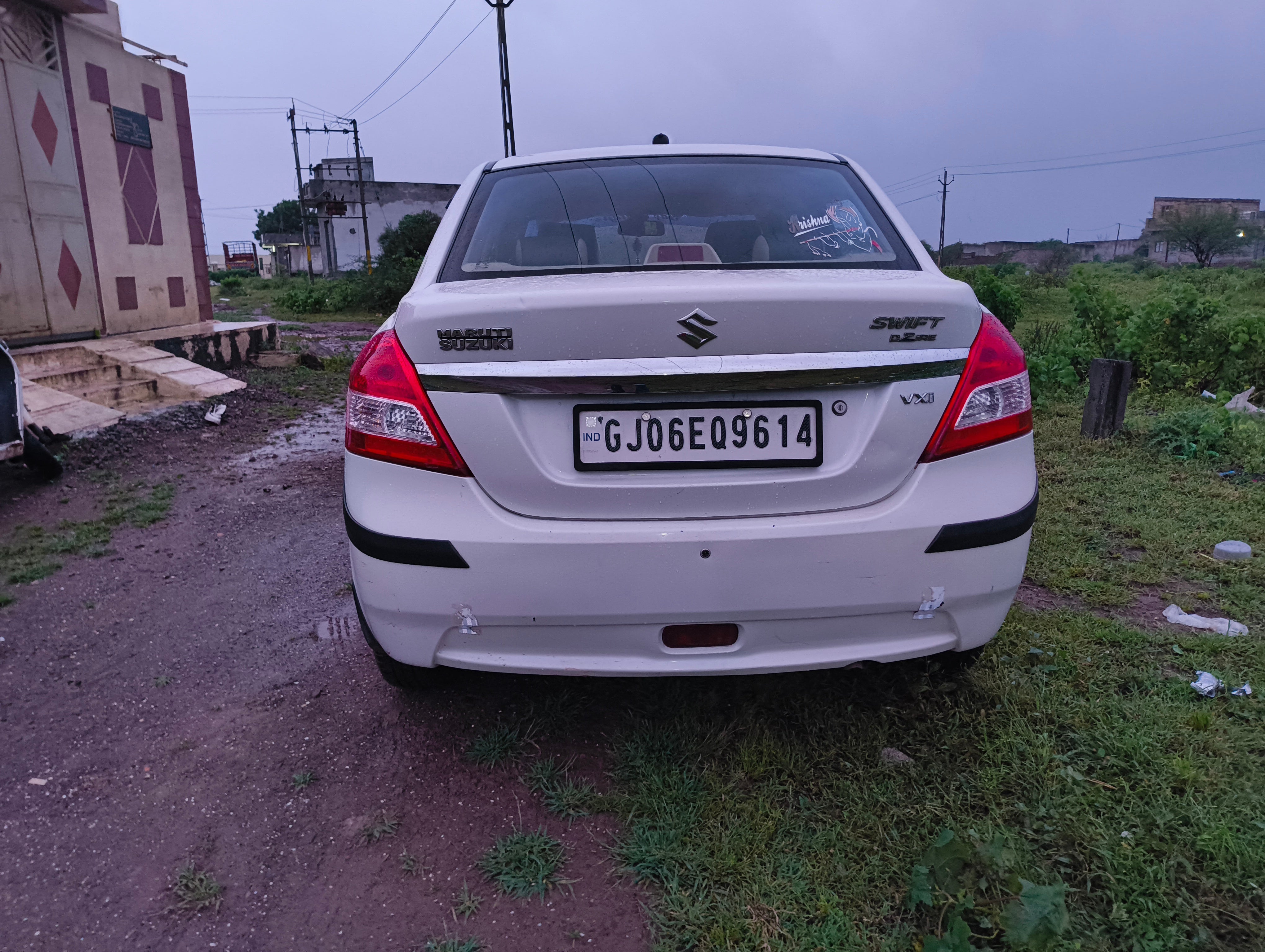 rear view of a Arctic White Maruti Suzuki Dzire 2018-2023
