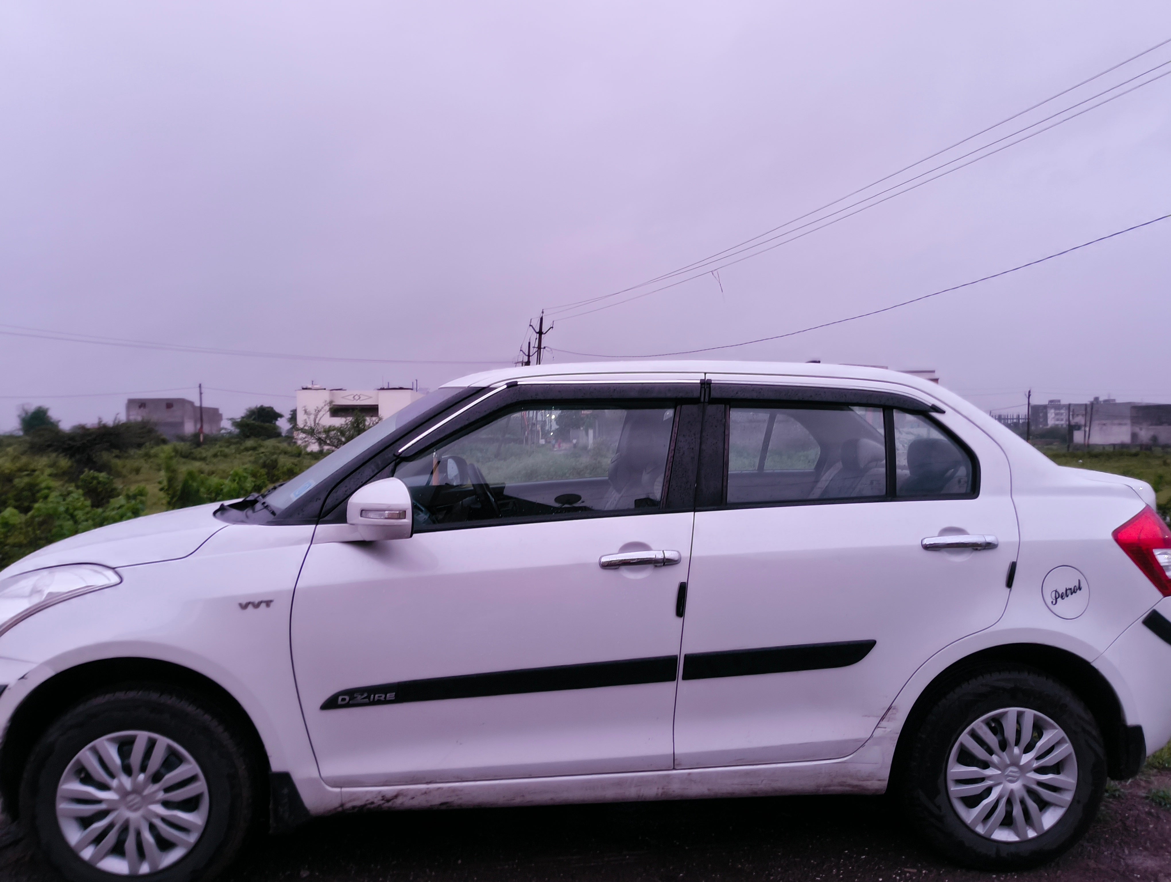 side view of a Arctic White Maruti Suzuki Dzire 2018-2023