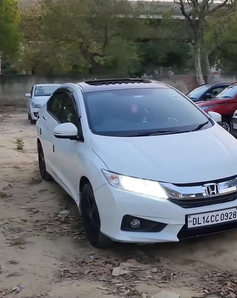 front three-quarter view of a Platinum White Pearl Honda City
