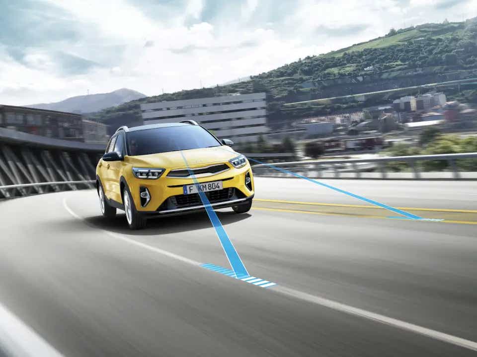 front three-quarter view of a Kia Stonic on a highway