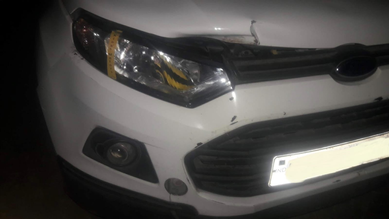 front view of a Ford Endeavour showing grille and headlight