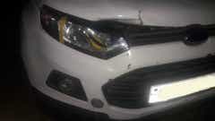 front view of a Ford Endeavour showing grille and headlight