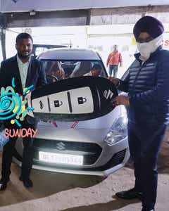 front view of a Metallic silky silver Maruti Suzuki Swift 2021 - 2023