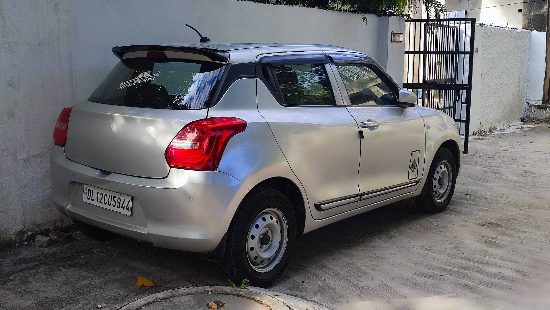 rear three-quarter of a Maruti Suzuki Swift 2021 - 2023