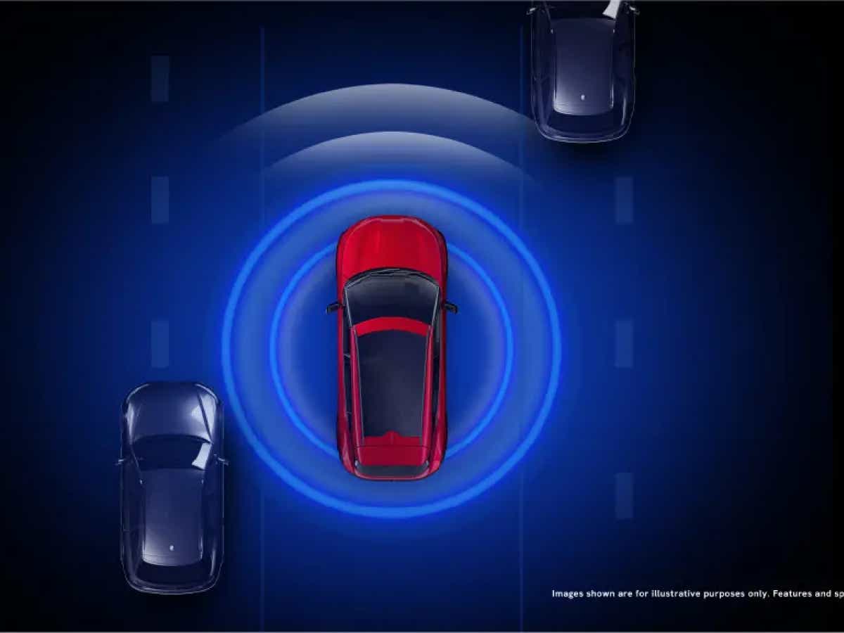 top view of a Crimson Red Vinfast VF7 with digital radar waves