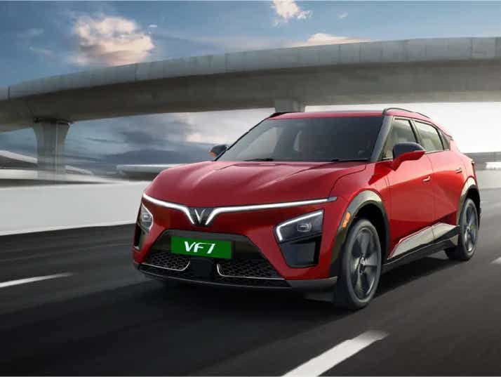 front three-quarter of a Crimson Red Vinfast VF7