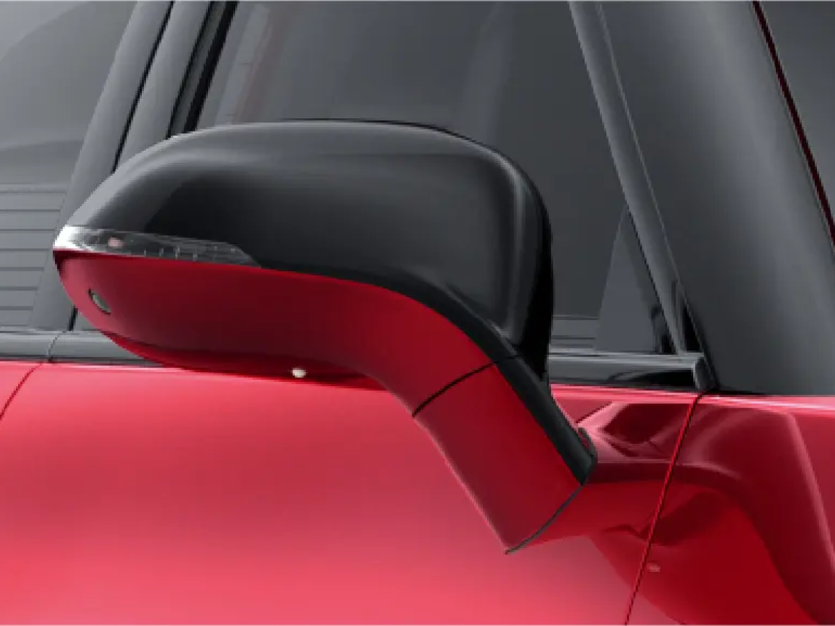 Side mirror close-up of a Vinfast VF7