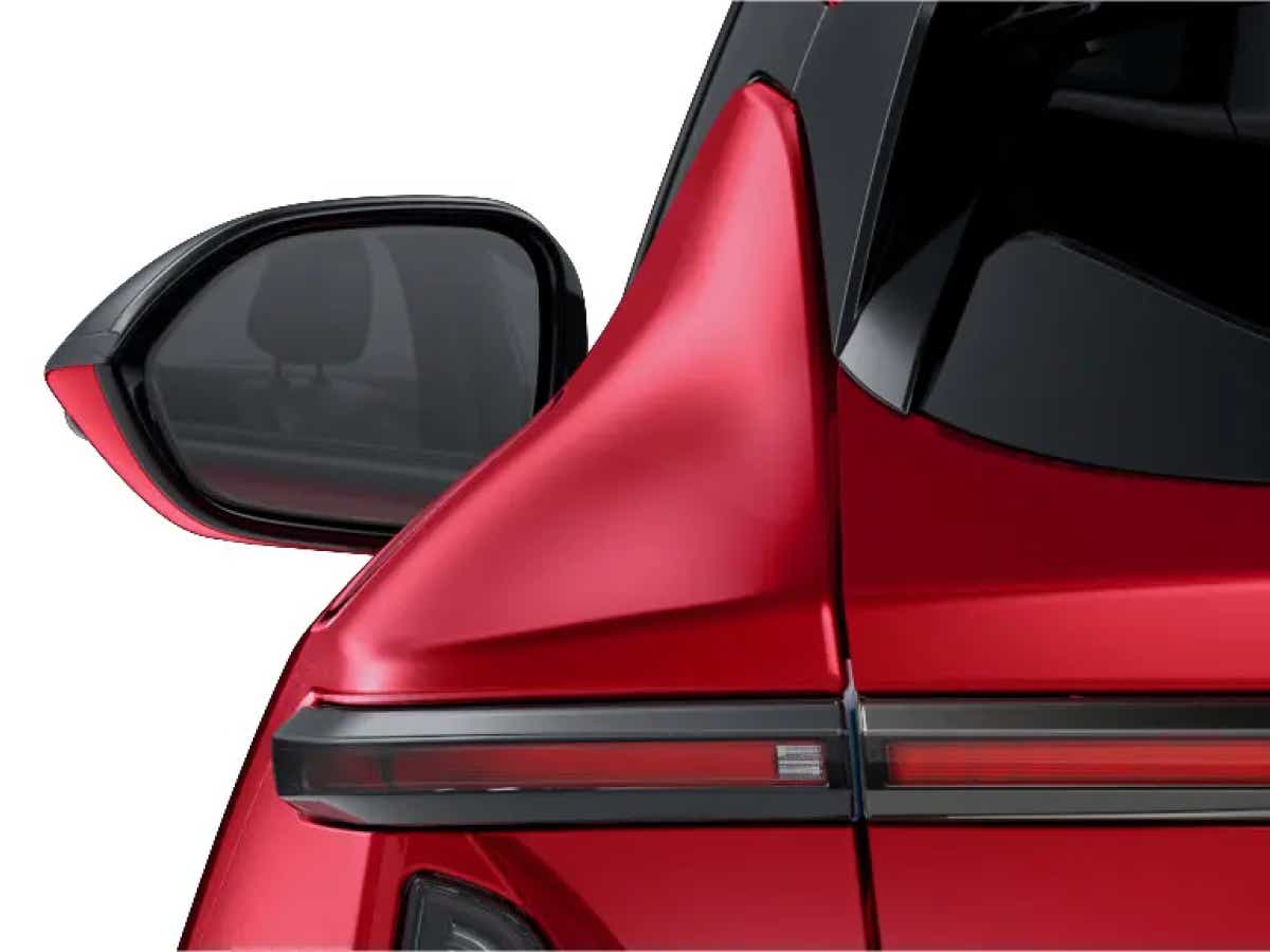 Side mirror and rear light detail of a Crimson Red Vinfast VF7