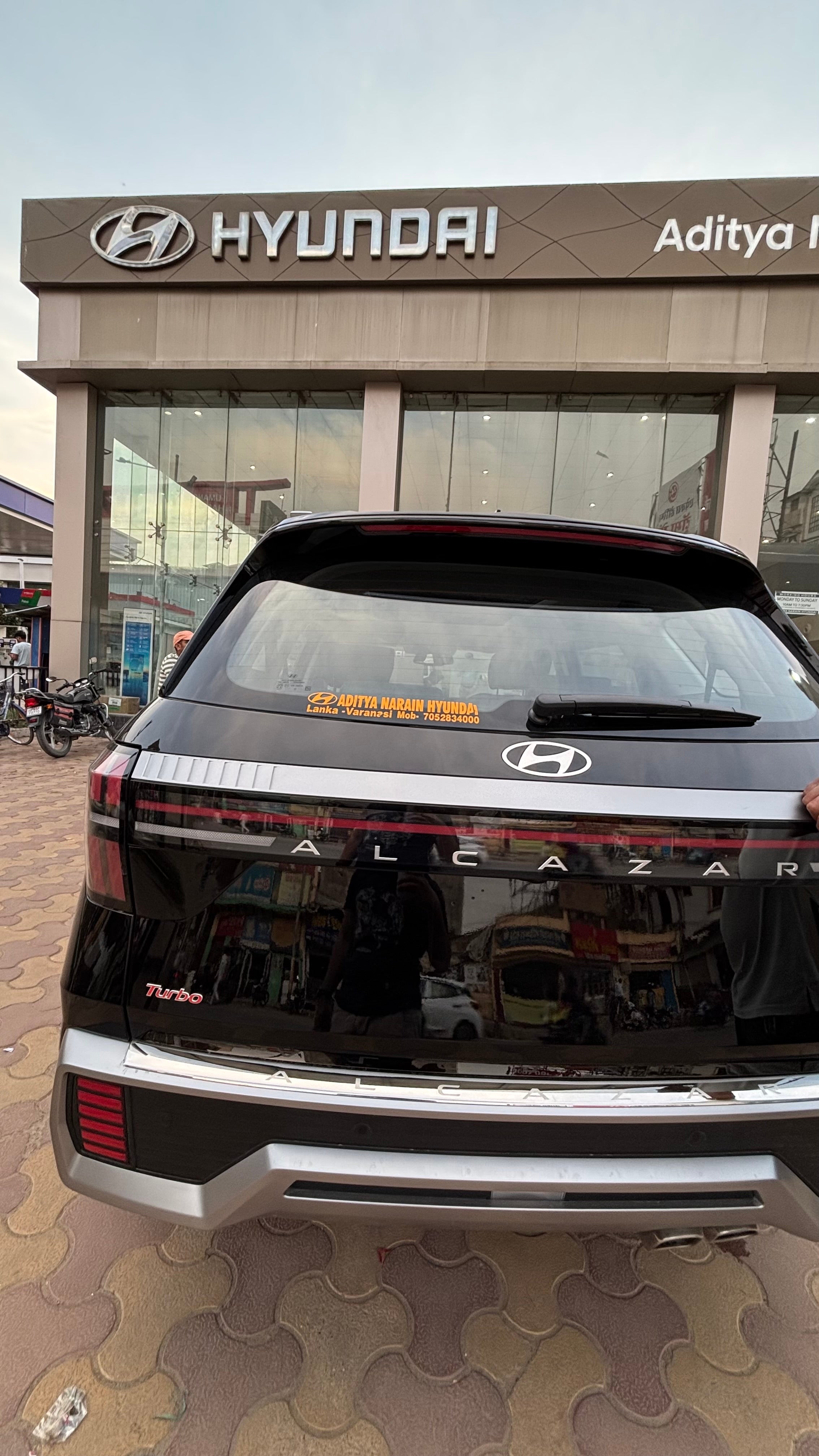 Rear view of a Hyundai Alcazar Turbo at a dealership