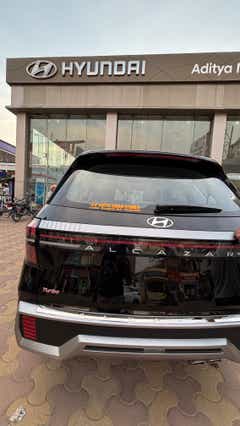 Rear view of a Hyundai Alcazar Turbo at a dealership