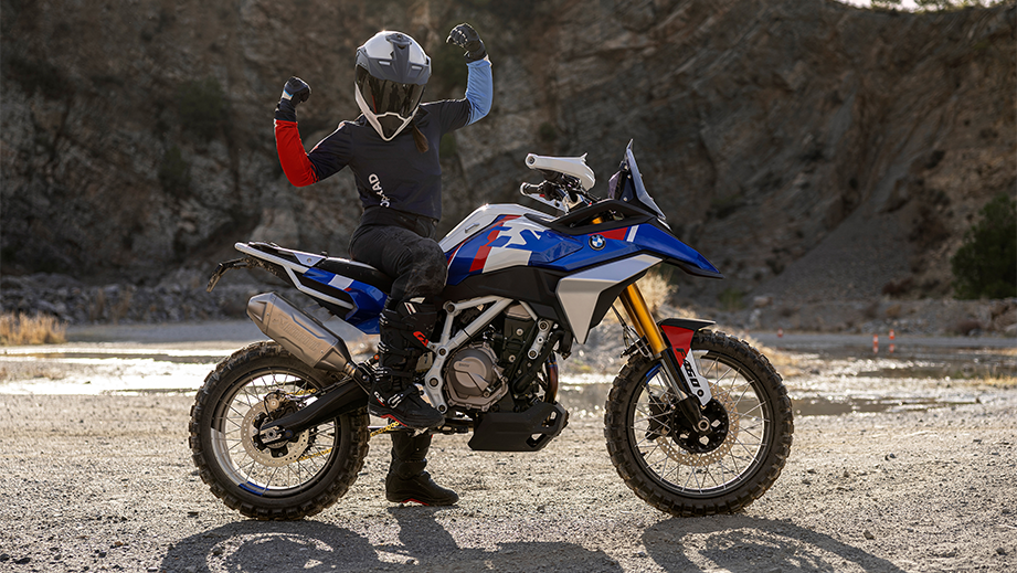 Side view of a BMW F 450 GS motorcycle with rider raising arms