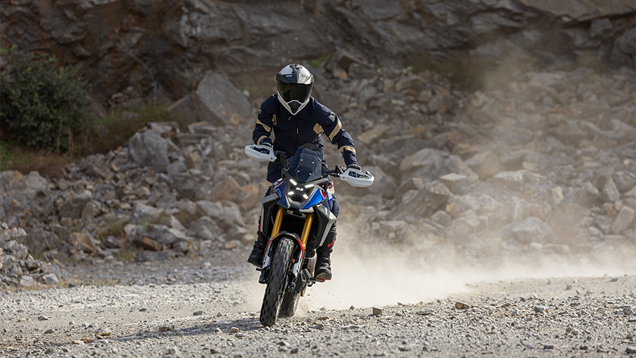 Frontal view of a BMW F 450 GS on a rocky road