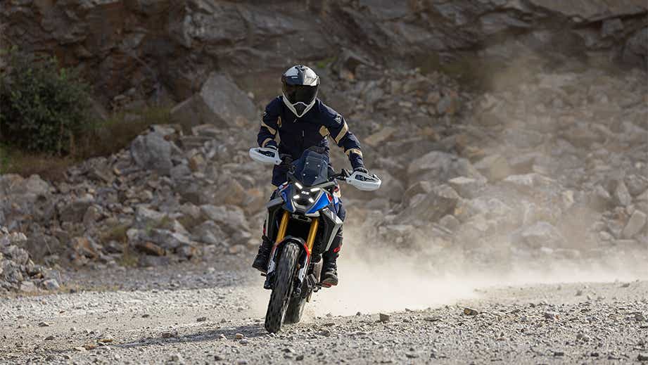 Frontal view of a BMW F 450 GS on a rocky road