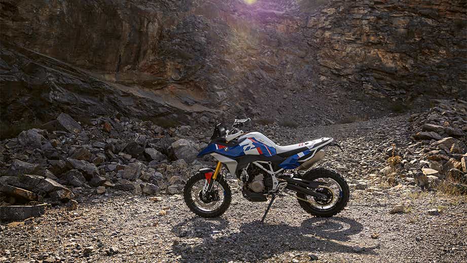 Side view of a BMW F 450 GS in a rocky outdoor setting