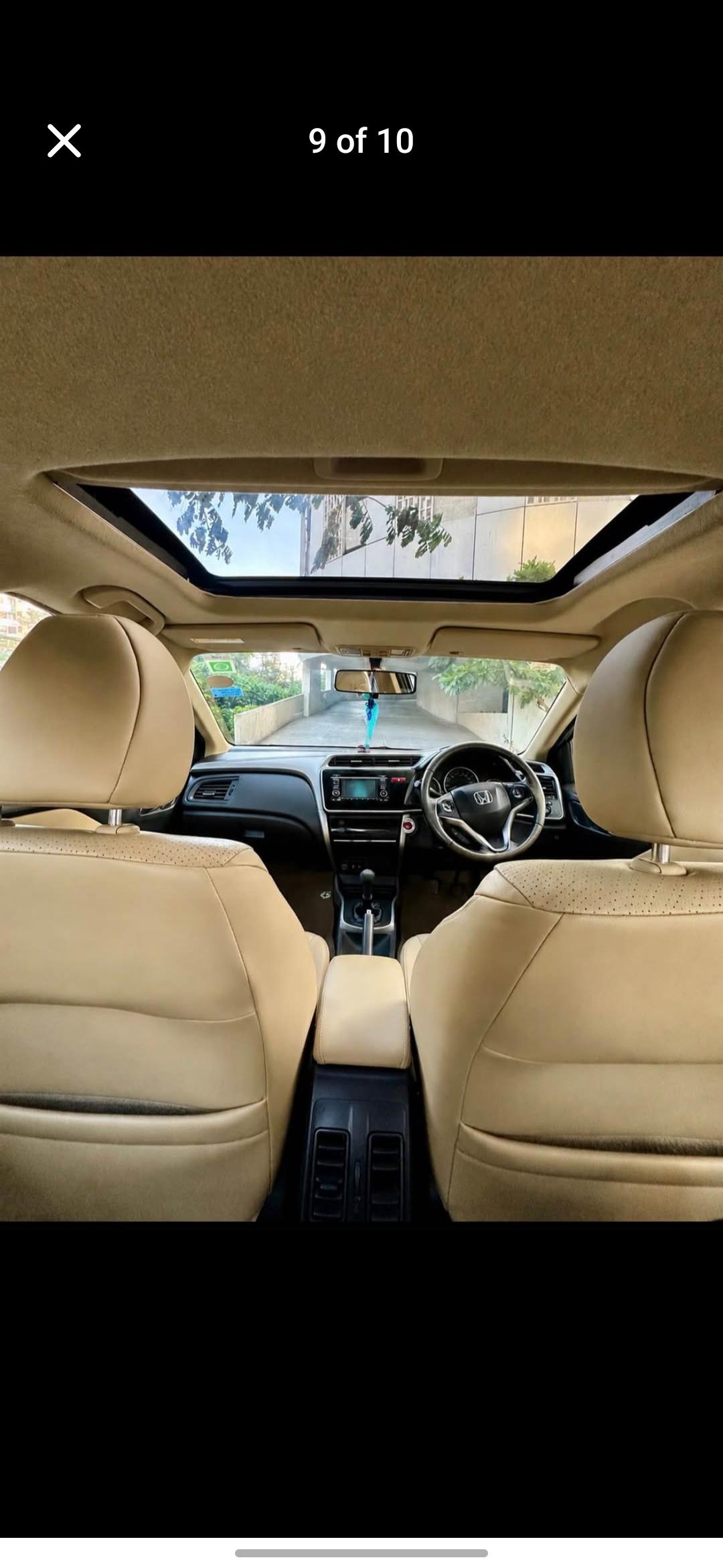 Interior dashboard and sunroof view of a Honda City