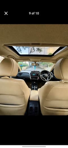 Interior dashboard and sunroof view of a Honda City