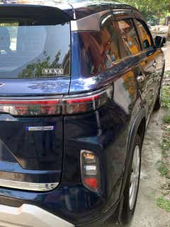 Rear three-quarter of a Nexa Blue Maruti Suzuki Grand Vitara