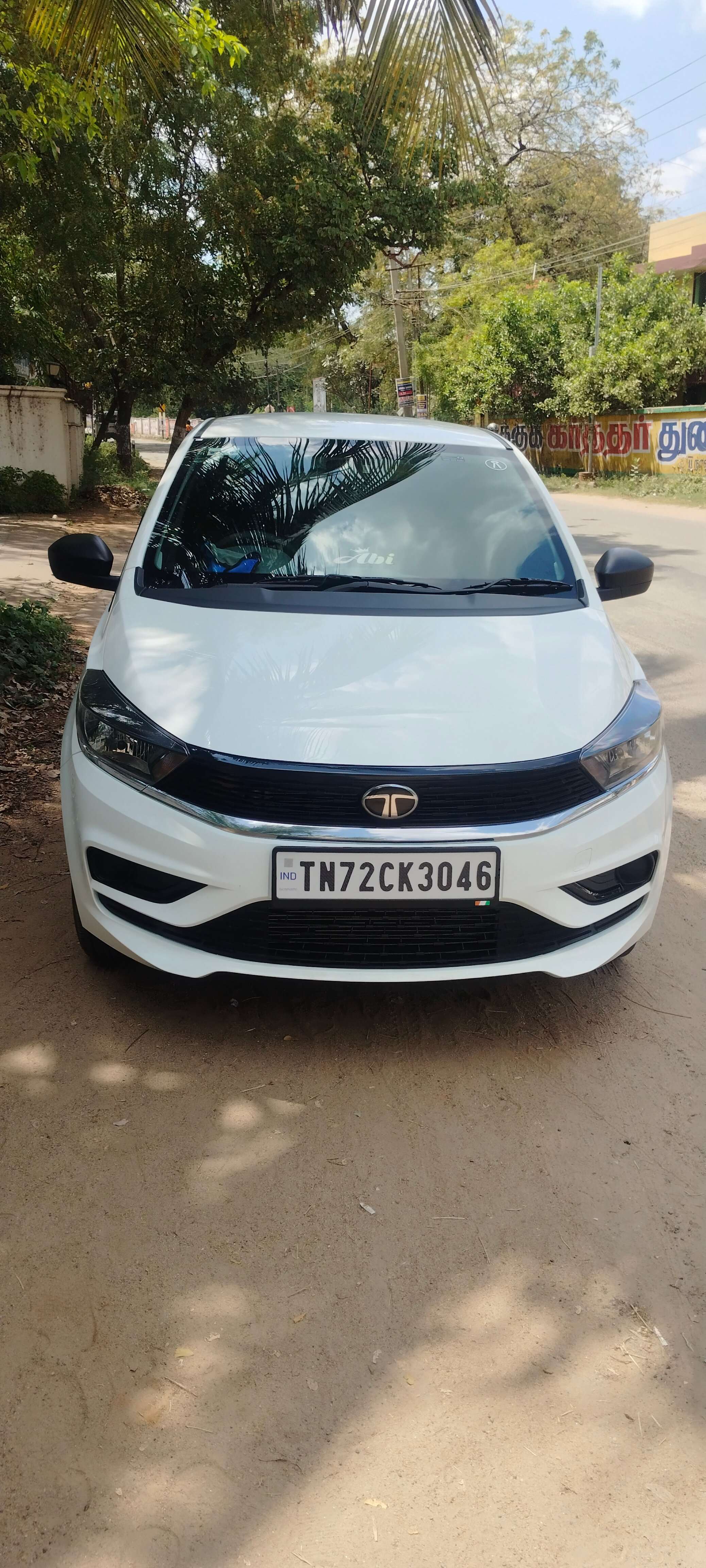 Front view of a Pristine White Tata Tiago