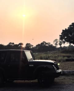 Front-side view of a Stealth Black Mahindra Thar