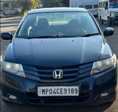 Front view of a obsidian blue pearl Honda City