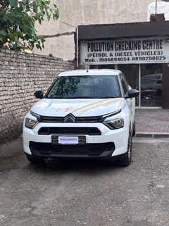 Front view of a polar white Citroen Basalt