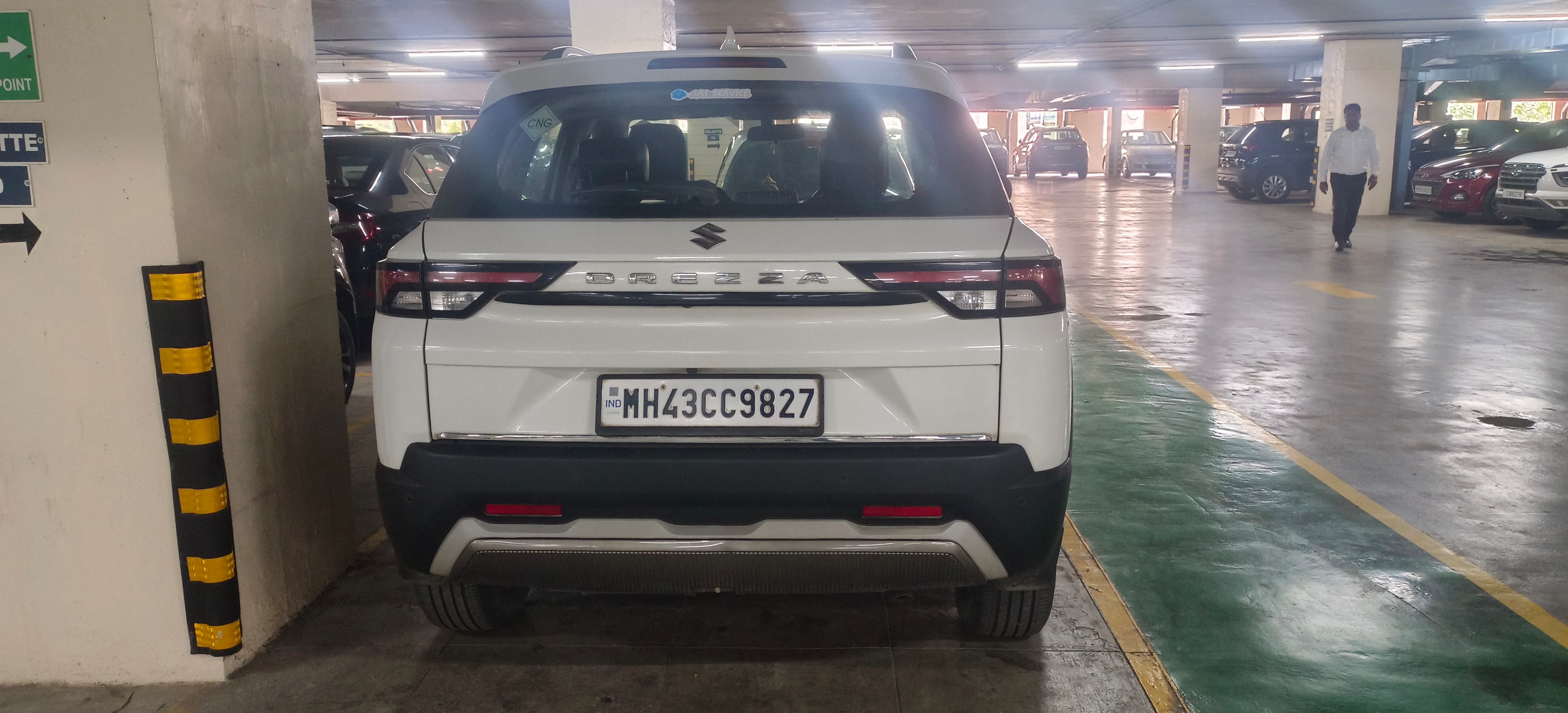 Rear view of a pearl-arctic-white Maruti Suzuki Brezza