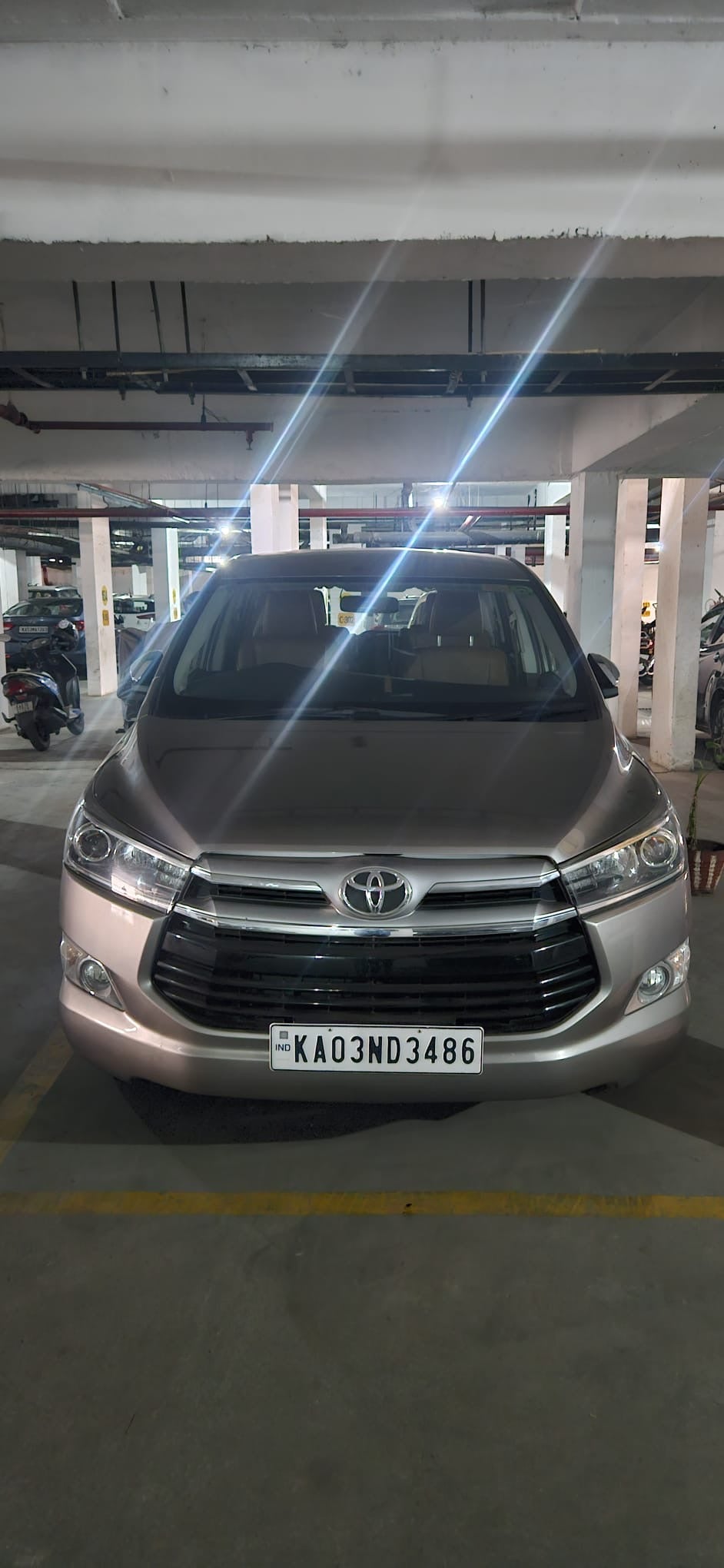 Front view of a silver metallic Toyota Innova Crysta