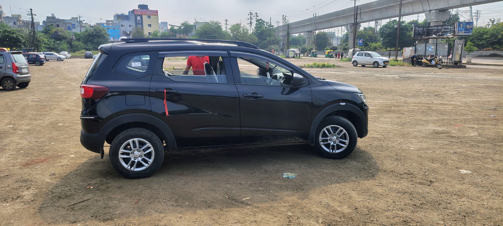 Side view of a stealth black Renault Triber