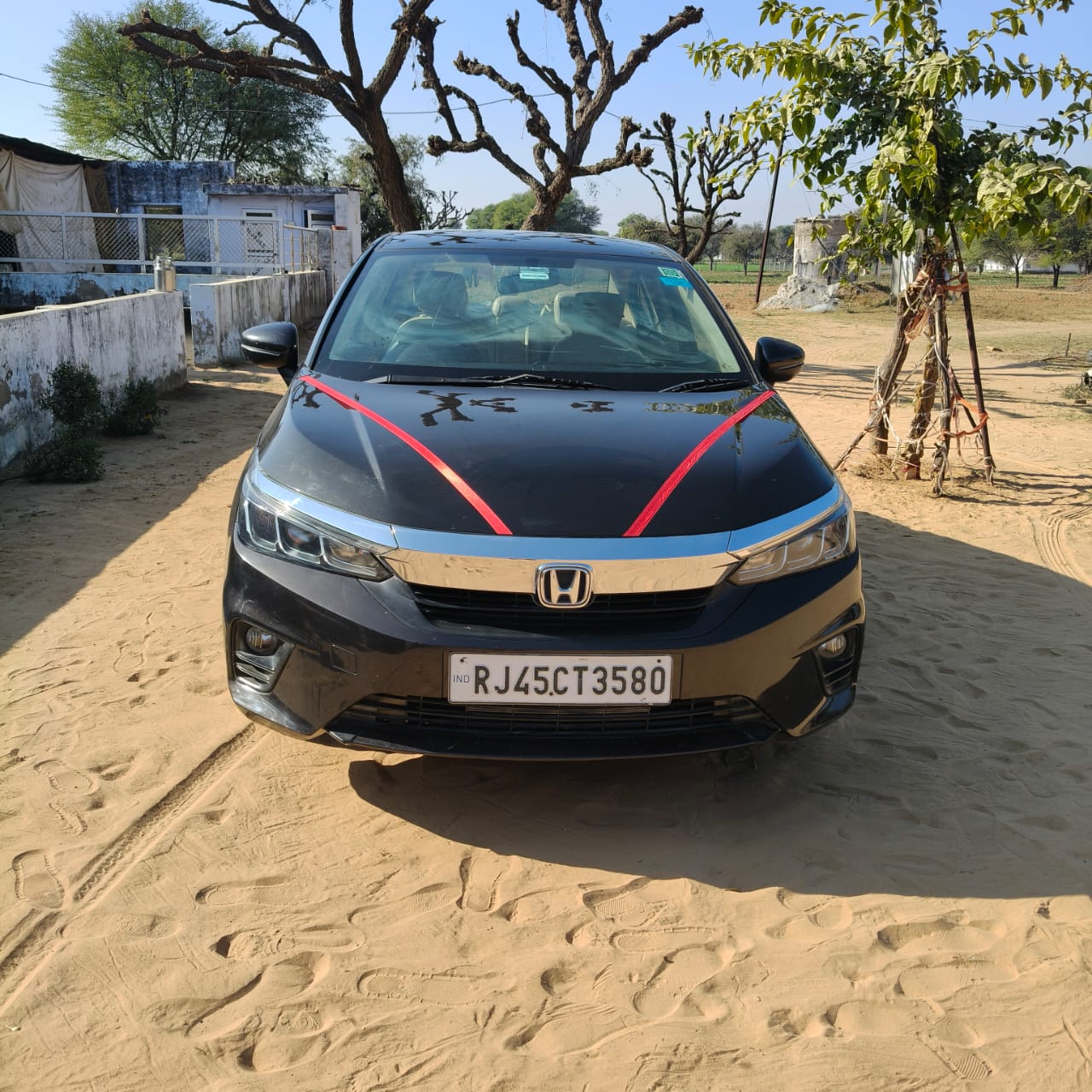 Front view of a obsidian blue pearl Honda City