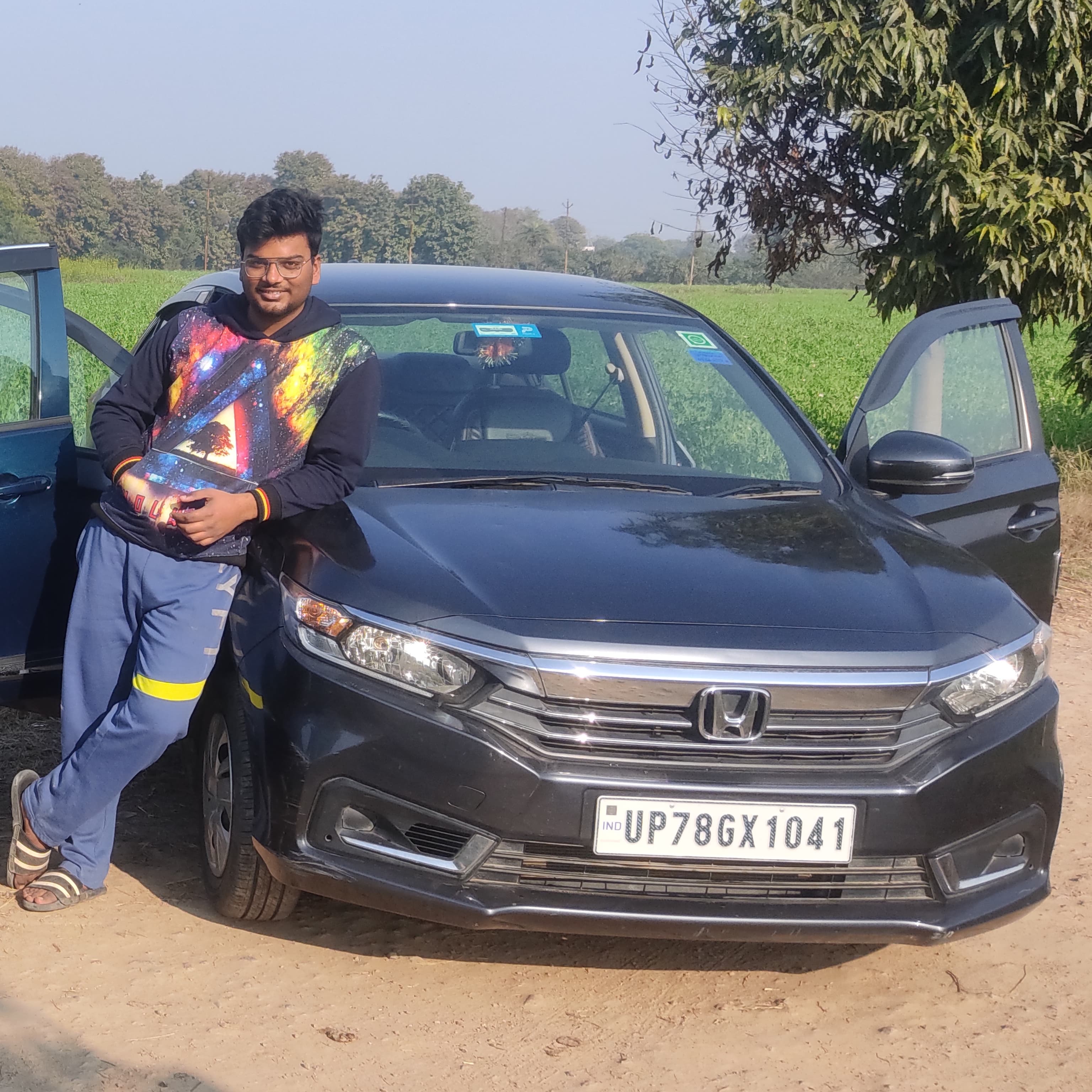 Front view of a meteoroid grey metallic Honda Amaze